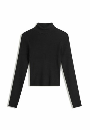 Pull à col roulé noir avec des côtes, à manches longues et au design cropped. Texture douce et silhouette ajustée.