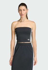 Čierny crop top bez ramienok s bielymi bočnými pásmi a malým logom vpredu. Hladká tkanina s priliehavým strihom.