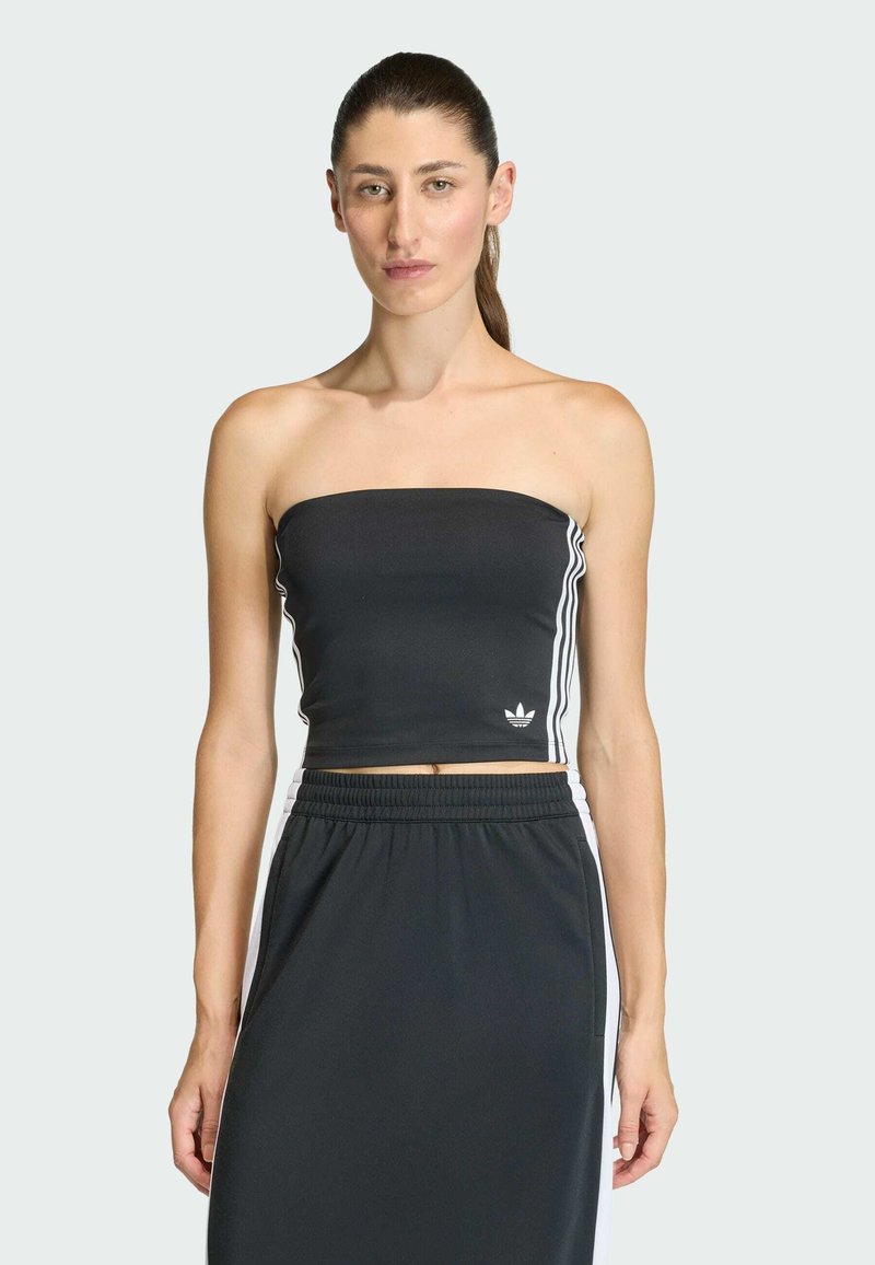 Čierny crop top bez ramienok s bielymi bočnými pásmi a malým logom vpredu. Hladká tkanina s priliehavým strihom.