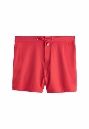 Red swim shorts with a drawstring waist and metal-tipped cords, displayed flat on a white background.