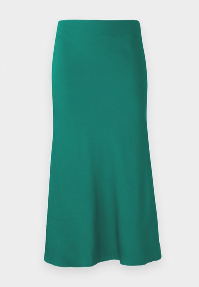 En grön, knälång kjol i slät tyg, med en utsvängd nederkant och en passform runt midjan. Inga synliga mönster eller detaljer i metall.