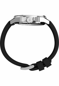 Bracelet de montre en silicone noir avec un boîtier en acier inoxydable argenté et un cadran rond. Il dispose d'une couronne texturée et d'une boucle simple.