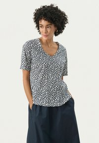 Top a maniche corte e scollo a V in navy e crema, con motivo floreale, realizzato in tessuto leggero, con vestibilità comoda e orlo curvo.