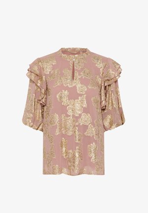 Rozā blūze ar zeltainiem ziedu rakstiem, ar viļņotām piedurknēm un atslēgas cauruma kakla atvērumu. Gaisīga, teksturēta auduma, ar brīvu piegriezumu.