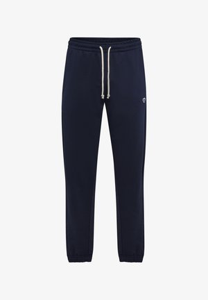 Pantalones de chándal azul marino con cintura elástica y cordón, bolsillos laterales y un pequeño detalle de logo. Tejido suave y texturizado.