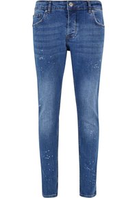 Jeans ajustados de mezclilla azul con textura desgastada y ligero desgarro. Presenta cinco bolsillos, un cierre de botón y trabillas para cinturón para ajustar.