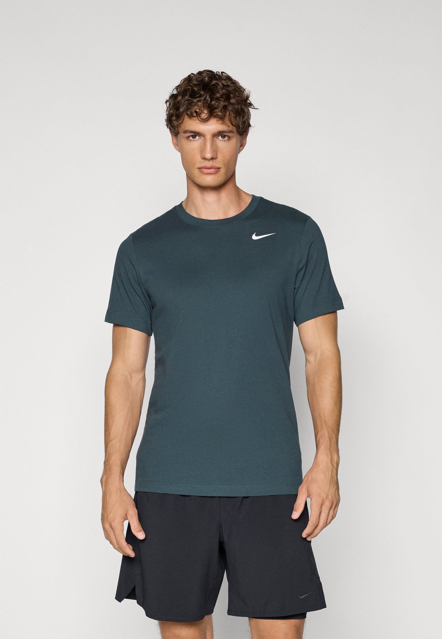 dark teal green nike shirt