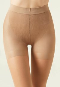 Beige formende shorts lavet af glat, strækbart stof med et struktureret mønster, der har en høj talje og en lår-længde skæring.