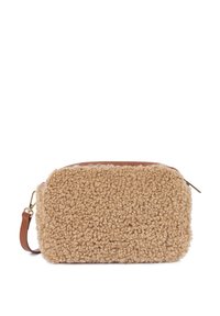 Beige fleece bag with a textured, fluffy exterior and a smooth brown leather top. Featuring a gold zipper and adjustable strap.