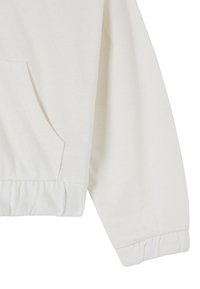 Sweatshirt bianco con una texture morbida, dotato di tasca a marsupio e polsini elasticizzati all'orlo. Design semplice e privo di decorazioni.