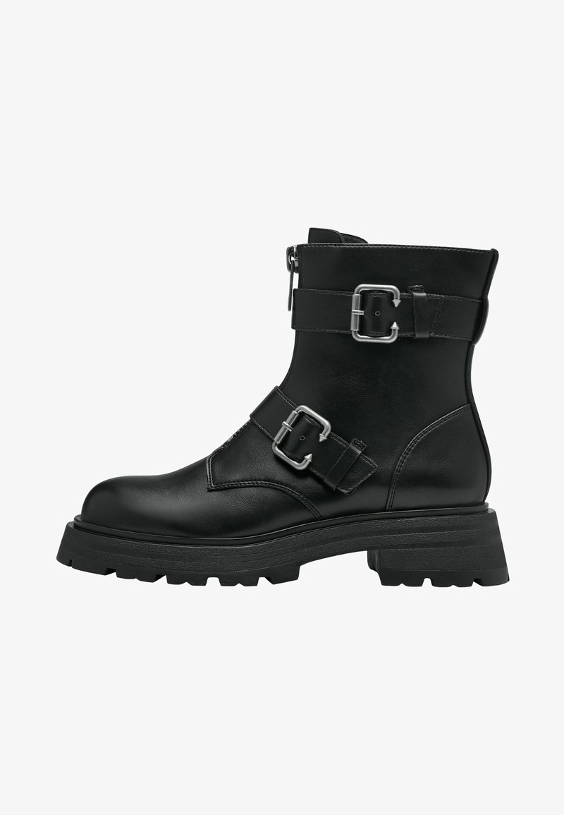 Bottines en cuir noir avec des sangles à double boucle, une fermeture éclair latérale et une semelle en caoutchouc épaisse. Elles présentent un bout arrondi et une finition texturée.