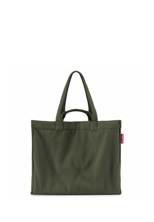 Donkergroene geribde stoffen tas met twee lange hengsels en een klein rood merklabel aan de zijkant.