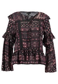 Blusa nera con stampa a disegni, maniche a volant, colletto con cordino e orlo a peplo. Il design include motivi floreali e geometrici in rosa.