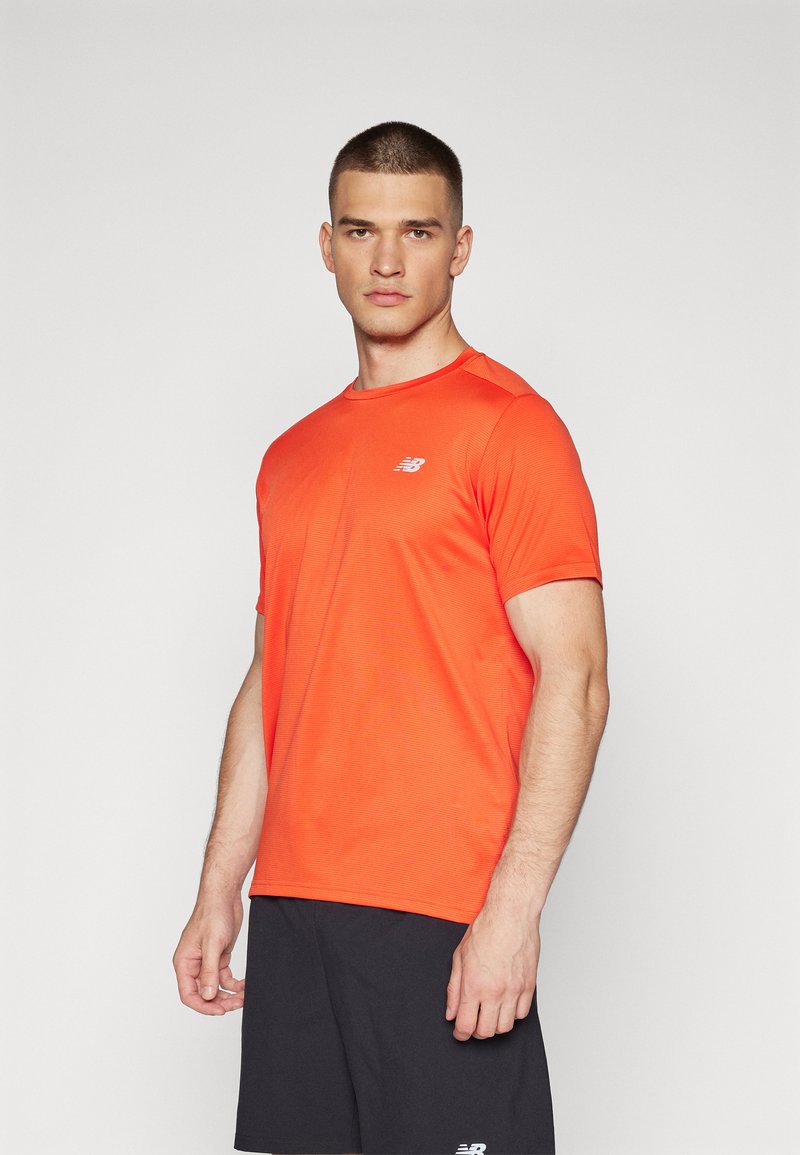 New Balance ESSENTIALS - Sport T-Shirt - neo flame