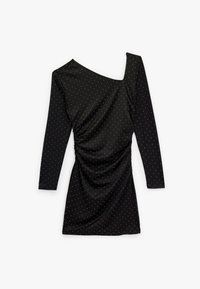 Zwarte jurk met lange mouwen, met een asymmetrische halslijn en geplooide details. Versierd met kleine zilveren stippen. Zachte textuur.