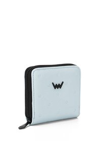 Light blue zippered wallet made of textured leather, featuring raised dots and a black logo. Compact square shape with contrasting zipper.