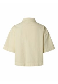 Vue de dos d'une chemise courte à manches courtes, beige clair, avec un col classique et un ourlet droit.
