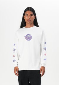 White long-sleeve t-shirt featuring a colorful "Santa Cruz" graphic at the center and whimsical planet designs on both sleeves.