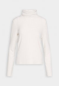 Top de cuello alto blanco de manga larga, hecho de material acanalado, con un patrón texturizado y una silueta ajustada.