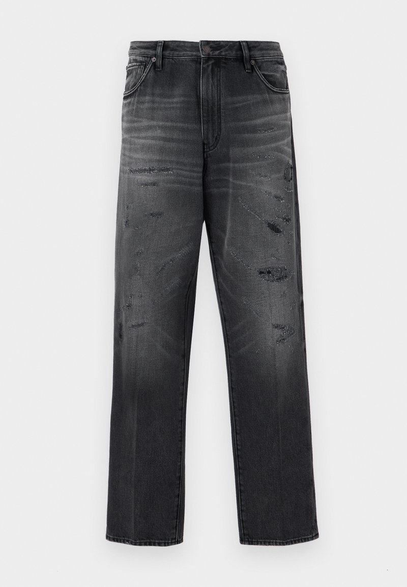 Jean en denim noir avec une coupe décontractée, présentant un design délavé et des patchs déchirés. Style standard cinq poches et fermeture à bouton.