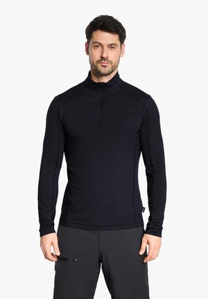 Black long-sleeve pullover with a high collar and a front zipper. Features flat seams and a fitted design made from stretchy fabric.