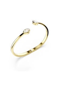 Goldene Armcuff mit zwei ovalen, klaren Steinen an jedem Ende, mit einer glatten, polierten Oberfläche und einem minimalistischen Design.