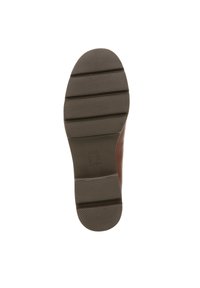 Bruine rubberen zool met horizontale groeven en ribbels voor grip; bevat een geëmbosseerde merknaam voor identificatie.