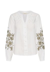 Camicia bianca con maniche lunghe, caratterizzata da ricami floreali verdi sulle maniche e cuciture decorative sulla parte anteriore.