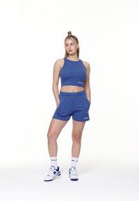 Pegador SULLY HIGH WAISTED - Tracksuit bottoms - washed true blue/white