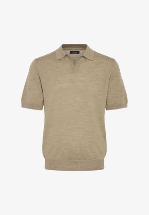 Kortærmet polo T-shirt i lys beige, lavet af blødt stof. Har en v-halsudskæring og ribbet kant ved kraven og kanten.