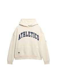 Cream-colored hoodie with a large navy "ATHLETICS" print. Features a kangaroo pocket, drawstring hood, and loose fit. Soft fabric texture.