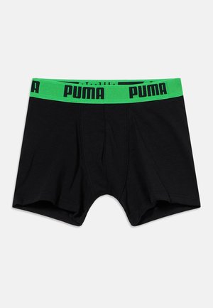 Boxer noir avec une ceinture taille verte brillante arborant le logo "PUMA" en noir, présenté sur un fond blanc uni.