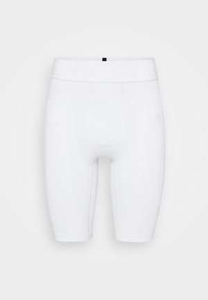 Weiße Sportshorts mit einer figurschmeichelnden Passform, gefertigt aus dehnbarem Material. Sie verfügen über einen elastischen Bund und ein dezentes Logo an der Seite.