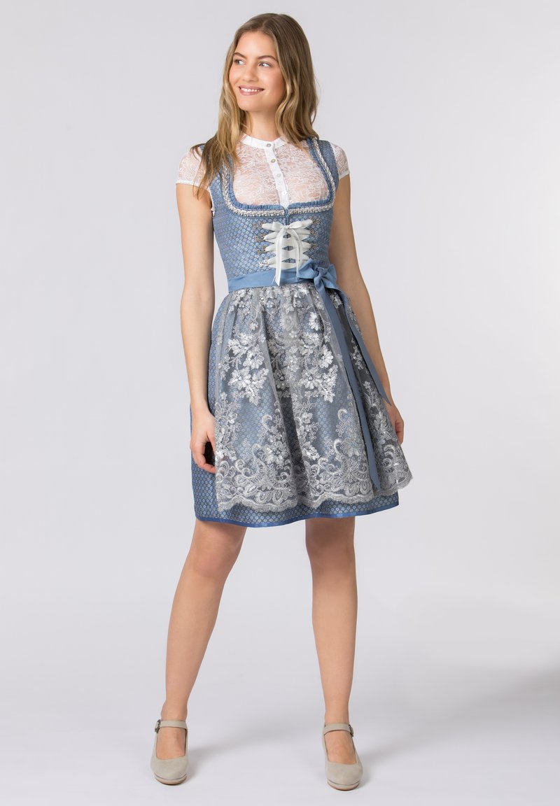 Blue dirndl dress with lace bodice and floral embroidery on the skirt, featuring a ribbon tie and short puff sleeves. Textured fabric.