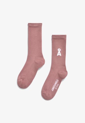 Ribbed pink cotton socks with white logo. Features a crew length, reinforced toe, and smooth texture.