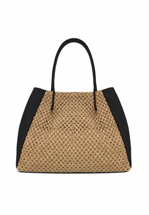 Sac fourre-tout beige tissé avec des panneaux latéraux en cuir noir et deux poignées noires sur fond blanc.