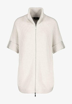 Cardigan court en maille couleur crème avec col haut côtelé et fermeture éclair devant.