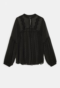 Blouse noire à manches longues en tissu transparent avec des points texturés, col rond et détails en dentelle aux épaules et au dos. Taille froncée.