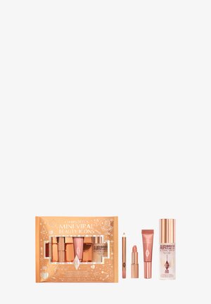 Mini-Viral-Beauty-Icons-Set in einer glänzenden roségoldenen Box. Enthält fünf Produkte: Lippenstift, Stift, Creme und Fixierspray, mit polierten Akzenten.