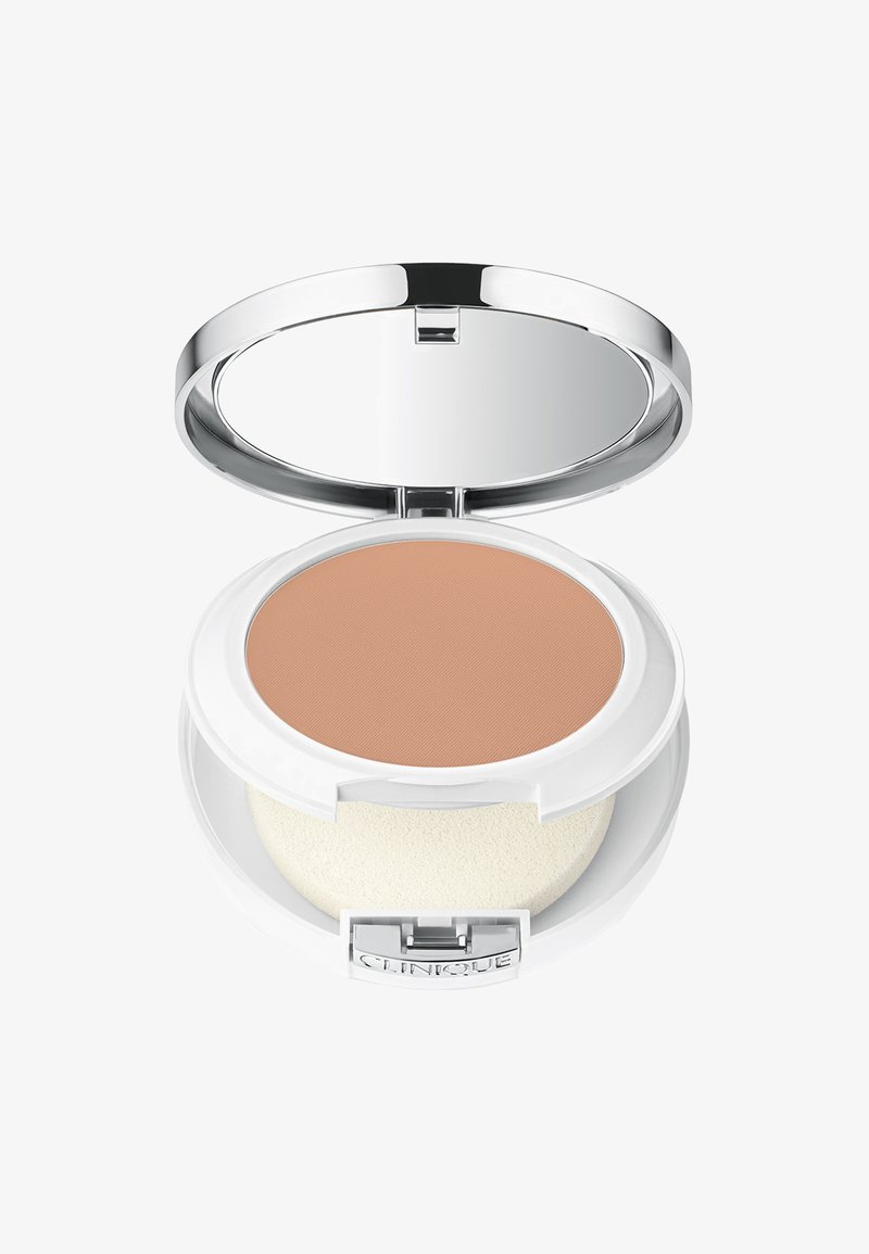 Compact poeder in een wit doosje met een spiegeledeksel. Bevat een beige poeder en een witte applicatorspons. Zilverkleurige hardwaredetails zichtbaar.