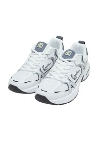 White athletic shoes with gray accents, mesh material, rounded toe, thick sole, and laces. Features embroidered logo on side and heel tab.