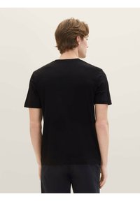 Black short-sleeve t-shirt made of cotton, featuring a classic crew neckline and a smooth, even texture on the fabric surface.