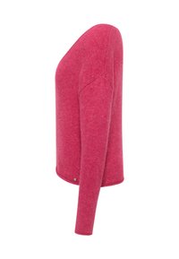 Figurbetonter rosa Pullover mit langen Ärmeln, Rundhalsausschnitt und seitlichen Schlitzen. Hergestellt aus weichem Strickstoff mit glatter Textur.