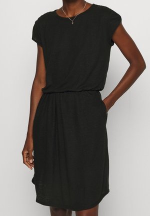 Black short-sleeve dress made of lightweight fabric; relaxed fit with an elastic waistband; knee-length with side pockets.