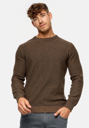 Brown textured sweater featuring a grid pattern, round neck, and long sleeves, made from a soft knit fabric.