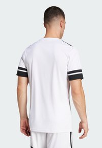 White short-sleeve t-shirt with black accents on sleeves, featuring a round neckline and a smooth texture, designed for casual wear.