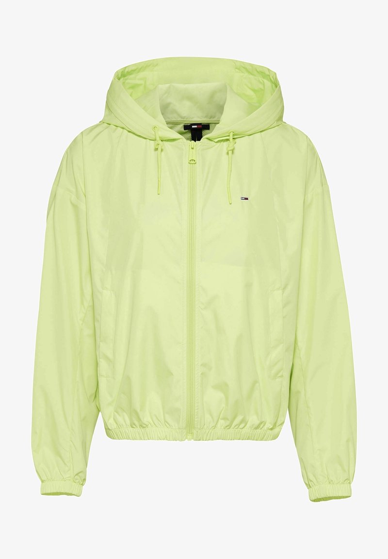 Lättviktsjacka med huva i neongul, med hel dragkedja, elastiska ärmslut och dragsko i nederkant. Inkluderar en liten logotypdetalj.