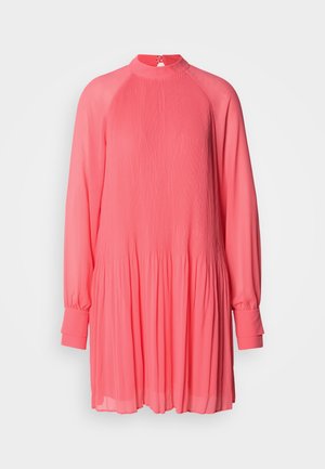 Pink pleated dress with a high neck, long sleeves, and a loose fit. Made from lightweight fabric with gathered detailing at the waist.