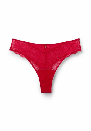 Red lace thong with floral pattern, scalloped edges, and a small satin bow at the waistband. The back features a seamless design.