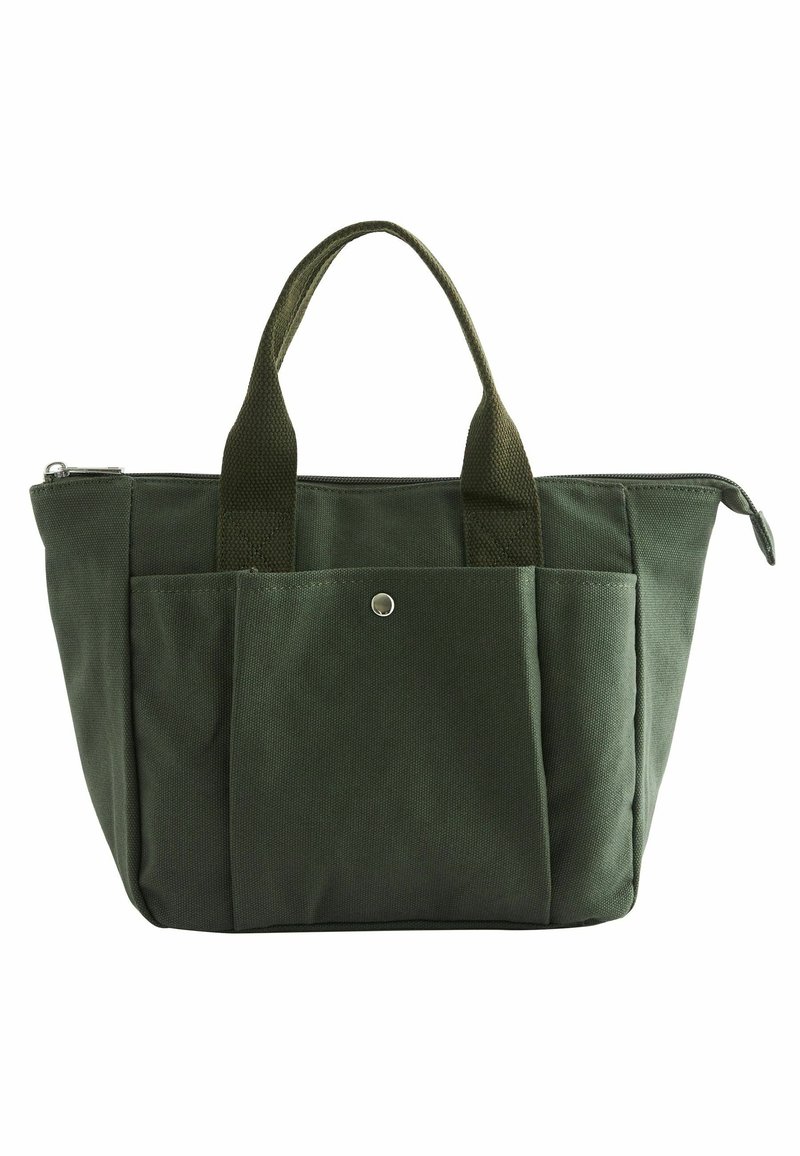 Sac cabas en toile vert foncé avec deux poignées, fermeture éclair supérieure et grande poche avant sécurisée par un bouton-pression en métal.